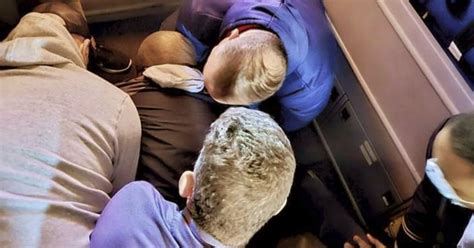 How passengers teamed up to restrain man on chaotic flight